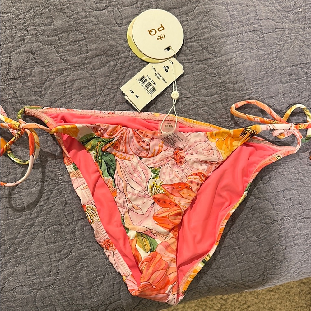 PQ Swim: Floral Bikini Bottom with Pink and Orange Accents.